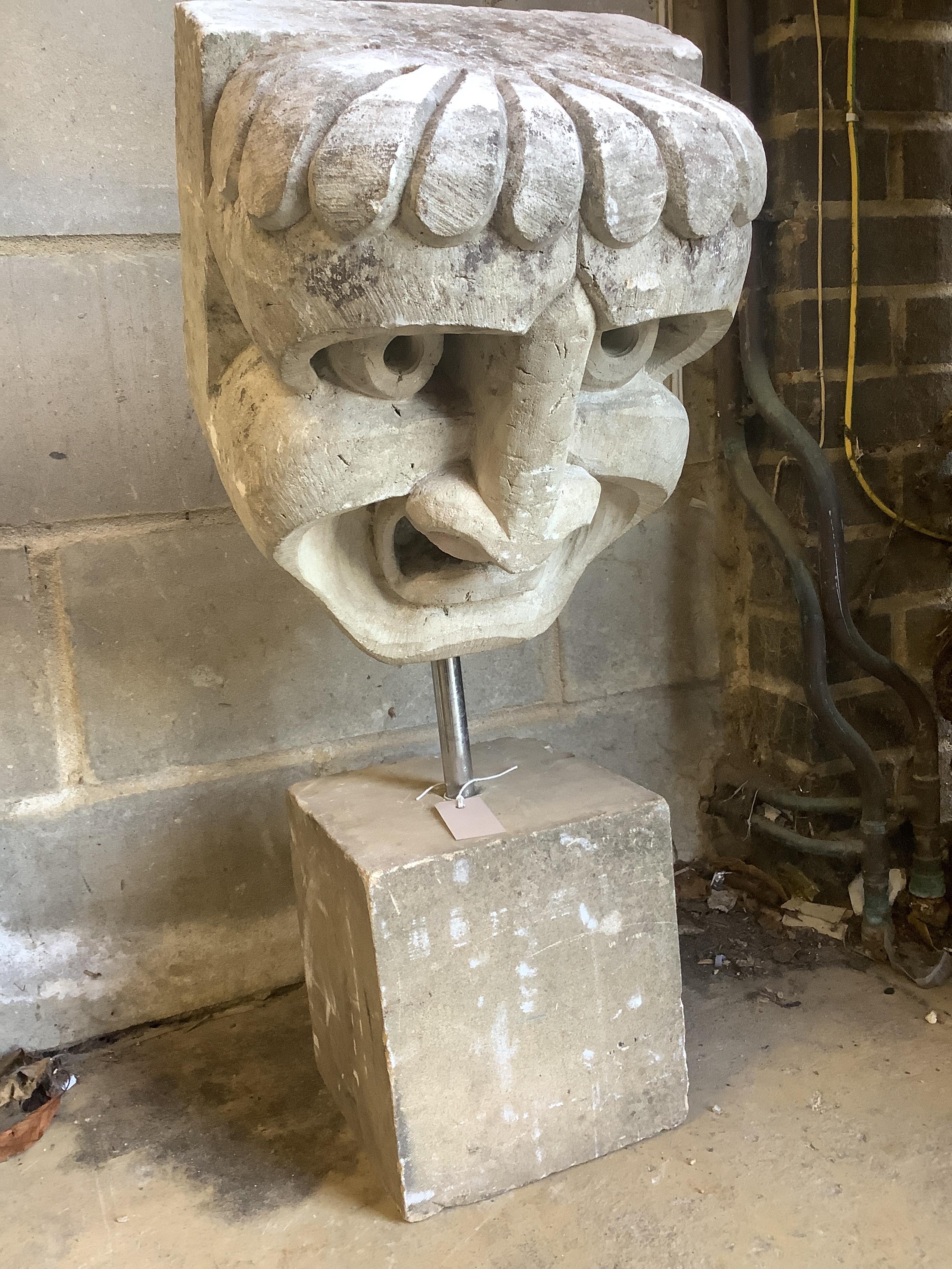 A stone carving on square plinth, 'The stare', height 76cm